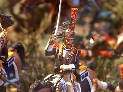 The craze for collecting toy soldiers began with the French in the 18th century. In this scene, British foot soldiers attack a French officer.