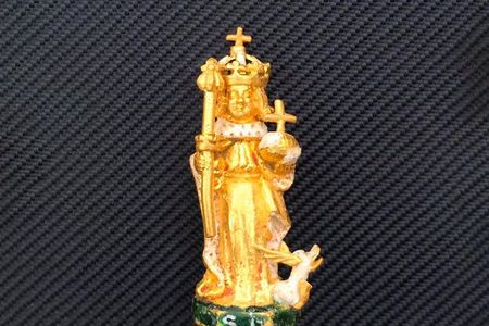 The gold figurine stands just 2.5 inches tall.
