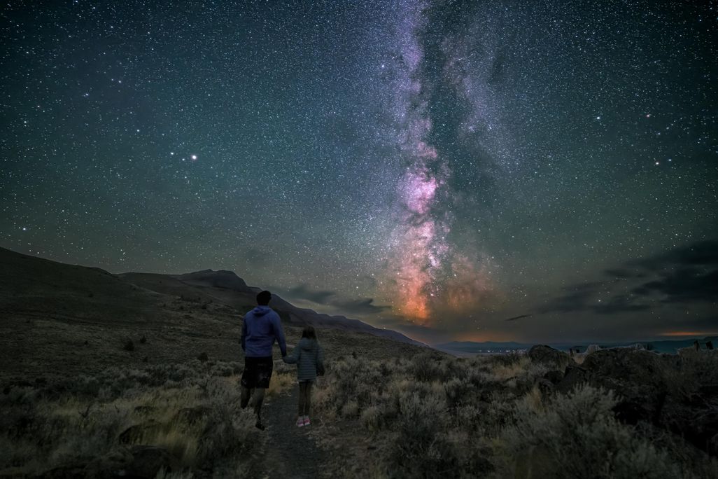 Milky Way above two people