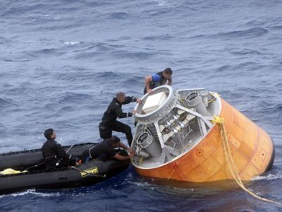 Indian Coast Guard divers recover the CARE capsule after yesterday's test. 