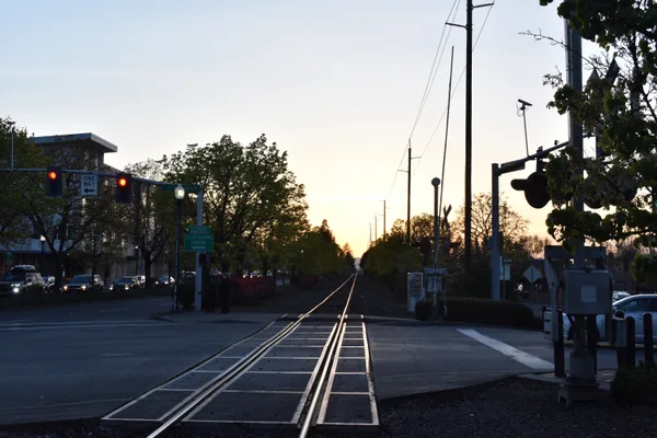 A sunset over railroad tracks in Beaverton, Oregon thumbnail