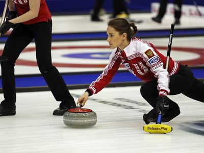 Russia's Anna Sidorova plays during the 2014 World Women's Curling Championship.
 