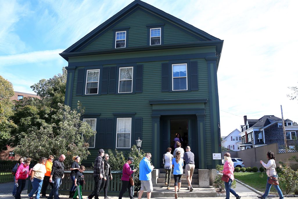 Tourists walk into the Lizzie Borden House