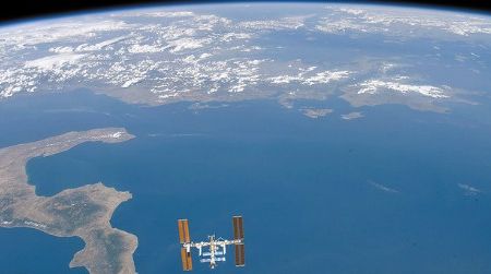 Is our world really not enough? Simple pleasures like swimming in the Adriatic Sea or hiking in the hills of Greece (in the upper right of the photo) will require staying on Earth.