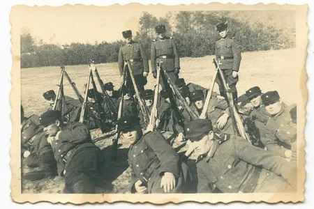 Historic records and biometric analysis suggest the man seen front row center in this 1943 image of Sobibor camp guards is John Demjanjuk.