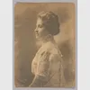 A black and white photograph of Mary Church Terrell seated in profile from the waist up. The left side of her face is visible. There is a photographer's stamp embossed in the bottom left corner.