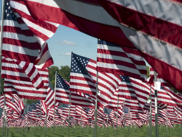 Display of flags with each flag representing a specific American who died in the line of duty since 9-11-2001 thumbnail