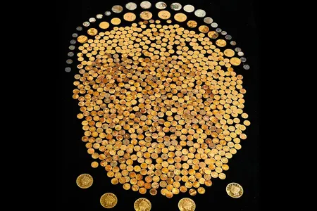 The 700-plus gold coins, found in a cornfield in Kentucky, date to between 1840 and 1863.