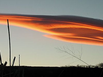Lenticular clouds tend to remain stationary; their longevity and their saucer-like appearance sometimes lead to misidentification as otherworldly spacecraft.