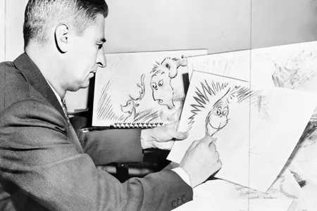 Dr. Seuss works on an early drawing of the Grinch.