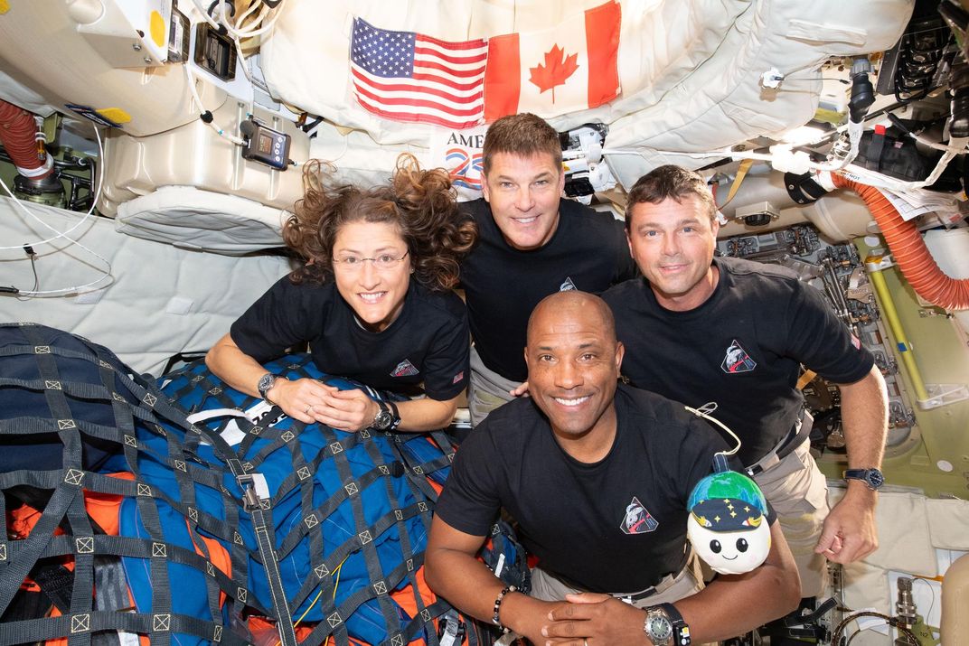 the four astronauts in space aboard Orion