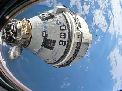 Boeing&#39;s Starliner spacecraft is seen docked at the ISS. After helium leaks and thruster issues, the craft will make an uncrewed return to Earth.