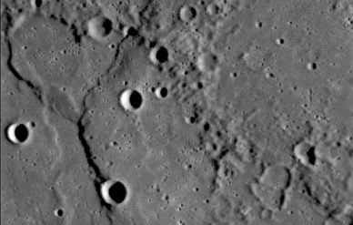 Cliffs (left) on Mercury seen by the MDIS narrow-angle camera during Messenger's January 14, 2008 flyby suggest that the planet's crust may have shrunk.