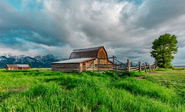 Barn with snow on the roof in the Tetons thumbnail