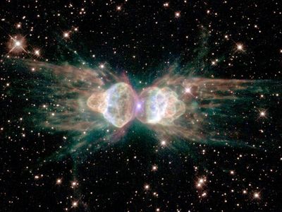 The Ant planetary nebula. Ejecting gas from the dying central star shows symmetrical patterns unlike the chaotic patterns of ordinary explosions.
