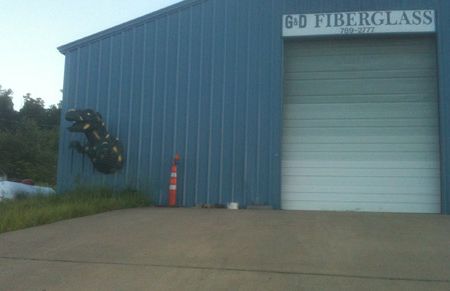 A Tyrannosaurus busting out of a fiberglass shop near Hindsville, Arkansas