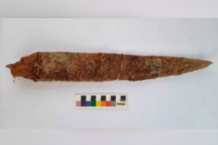 This iron dagger's well-preserved wooden handle may help researchers date artifacts found in Konthagai.