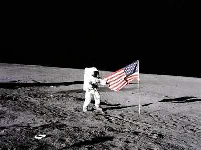 Astronaut Charles "Pete" Conrad sets up the American flag on the Moon during Apollo 12 on November 19, 1969.