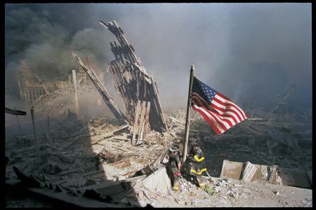 Three firefighters—George Johnson, Dan McWilliams and Bill Eisengrein—raising the American flag on September 11, 2001. This last of the series remains the most striking, yet least-known depiction of this scene.