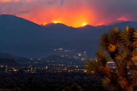Flames and smoke cover the hillsides near Yucca Valley in California during a June wildfire.