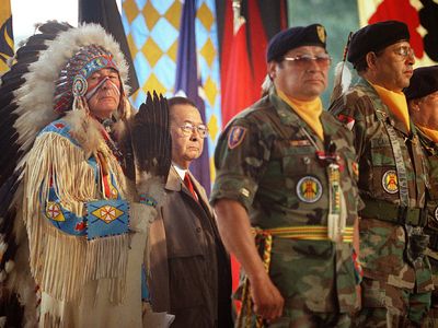 U.S. senators Ben Nighthorse Campbell, dressed in ceremonial Northern Cheyenne regalia, and Daniel K. Inouye, a member of the Senate Indian Affairs Committee, stand with Native American Vietnam veterans during the opening of the National Museum of the American Indian in 2004.