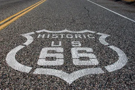 A Route 66 shield marks the storied highway in Needles, California.
