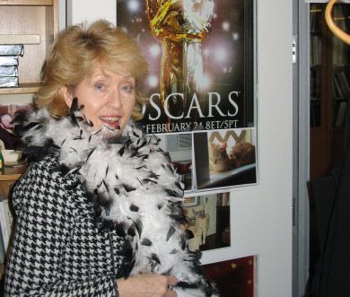 Historian Amy Henderson at work, wearing her boa