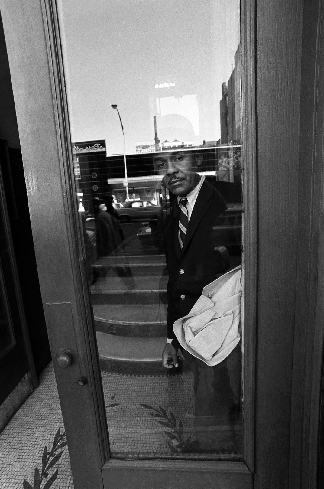 Ralph Ellison portrait behind glass door