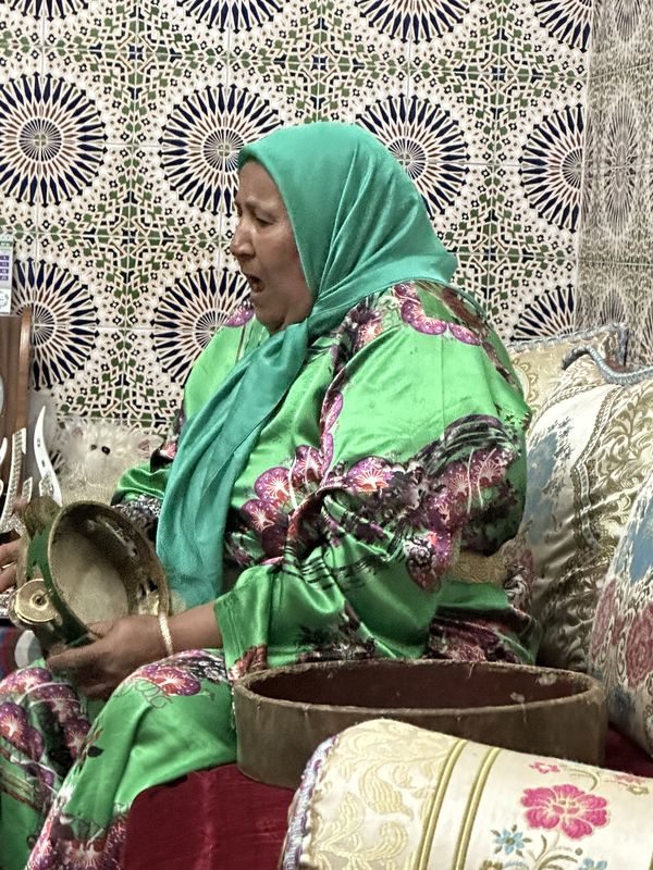 Moroccan woman singing and playing tamborine. thumbnail