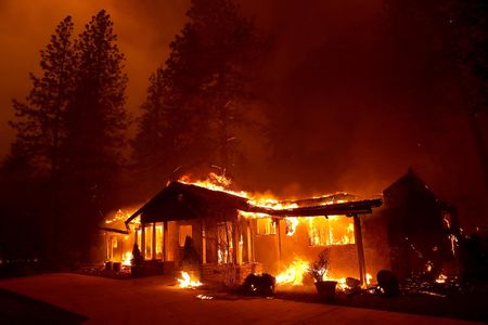 A home burns as the Camp Fire moves through the area on November 8, 2018 in Paradise, California.