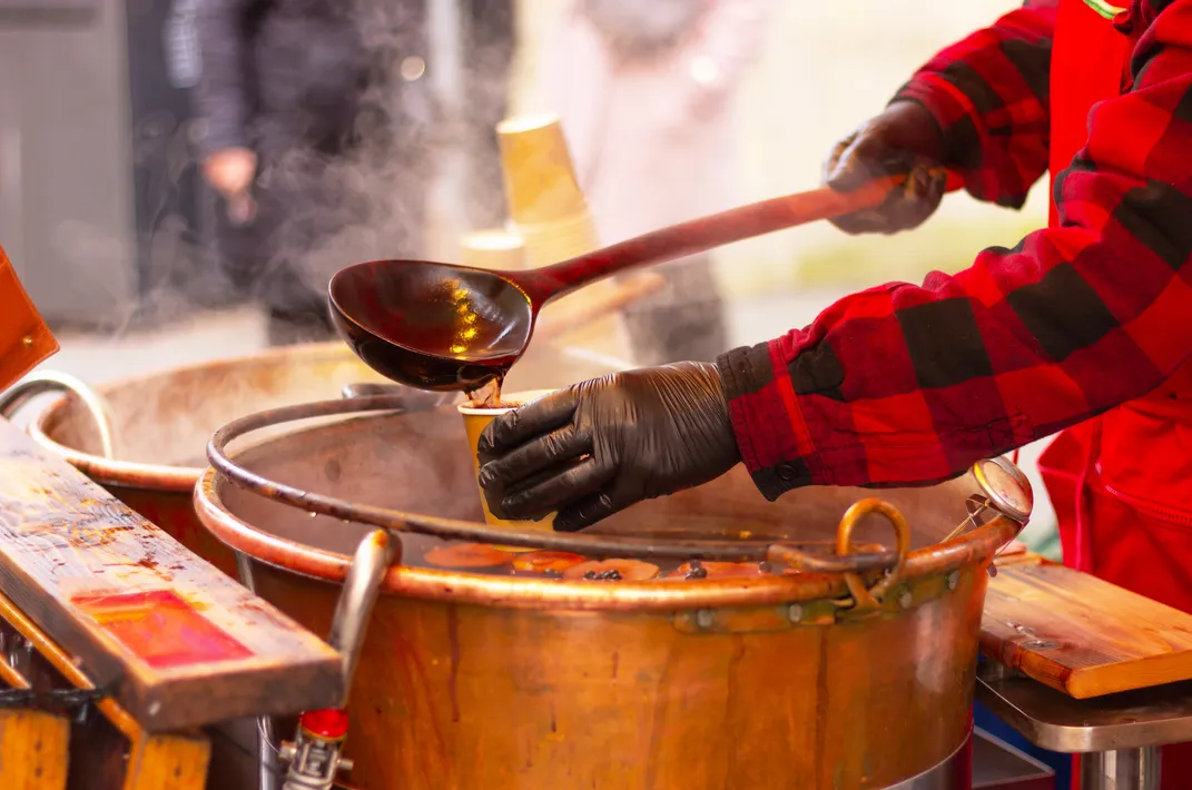 Serving traditional mulled wine at a holiday market