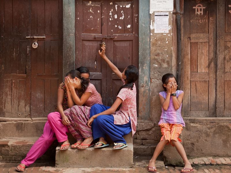 A group of very shy young ladies in the streets of Nepal image