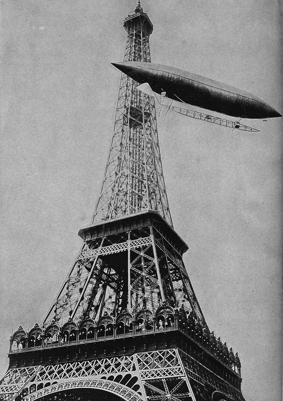 Santos-Dumont circles the Eiffel Tower in an airship on July 13, 1901.