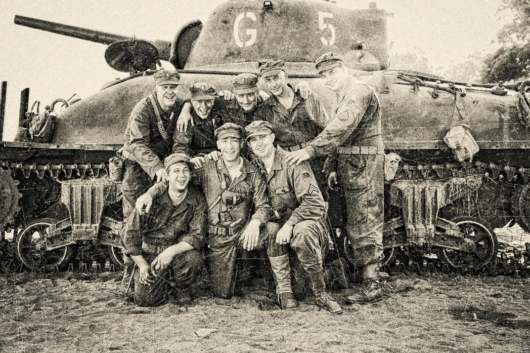 Archival photo of soldiers with their Sherman tank