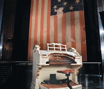 The Smithsonian's Wurlitzer (its console above, with the Star-Spangled Banner) likely played the national anthem before movies.