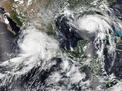 Hurricane Nora off the coast of Mexico and Hurricane Ida gaining strength in the Gulf of Mexico on&nbsp;August 28, 2021.
