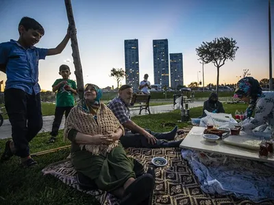People enjoy a picnic at the Zeytiburna coastline in Istanbul, Turkey, on August 23, 2020.