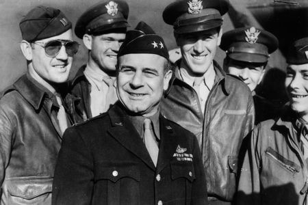 Eighth Air Force Commander James Doolittle surrounded by a group of American flyers.