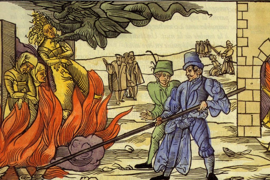 colored illustration of witches being burned at stake