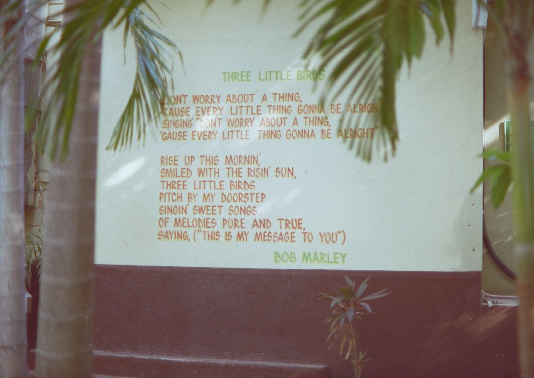 A mural with the lyrics to one Bob Marley's hit songs, "Three Little Birds"