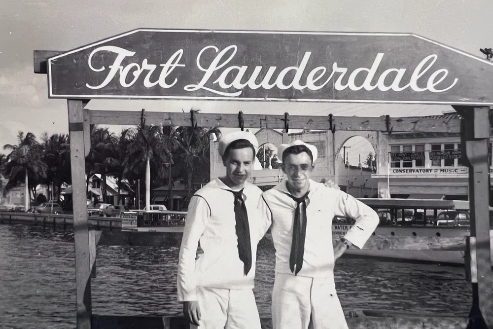 Walter Reed Parpart Jr. (right), the radioman on one of the missing planes, poses in front of a Fort Lauderdale sign in 1945