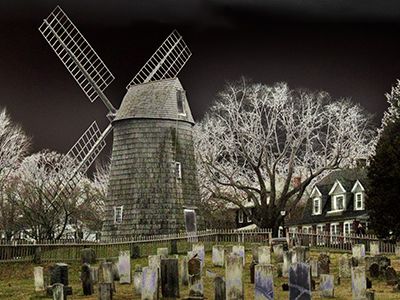 Years before the infamous events of Salem, Easthampton, New York was riddled with allegations of witchcraft. Pictured is an old windmill next to a graveyard in the small town.
