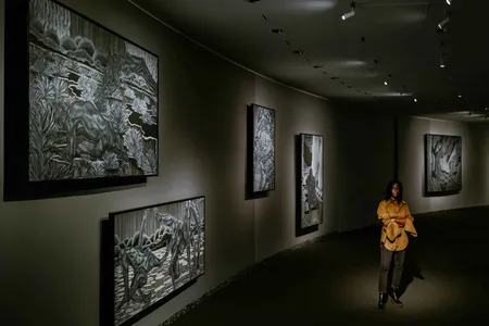 Toyin Ojih Odutola (above) &ldquo;flips the script in every aspect,&quot; she says of her 40 charcoal and pastel drawings depicting a story about a strong race of women, called the&nbsp;Eshu,&nbsp;who rule over humanoid men made to work in the mines or to cultivate food.