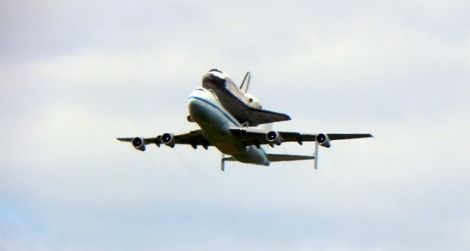 Space Shuttle Discovery flies over Washington, DC.