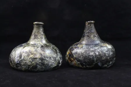 Layers of glass were flaking off the bottles due to a process known as &quot;delamination.&quot; Conservators coated the artifacts with an acrylic resin to help preserve them.