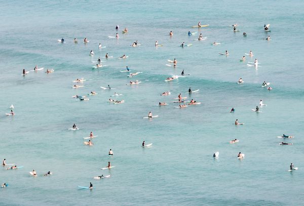 Surfers off of Waikiki Beach thumbnail