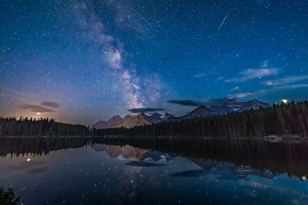 A view of the night sky looking south at Herbert Lake, Banff National Park, Alberta, shows the Milky Way over Mount Temple