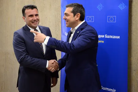 Macedonia's Prime Minister Zoran Zaev, left, speaks with Greek Prime Minister Alexis Tsipras prior to meeting on the sidelines of EU and Western Balkan heads of state at the National Palace of Culture in Sofia, Bulgaria, Thursday, May 17, 2018.