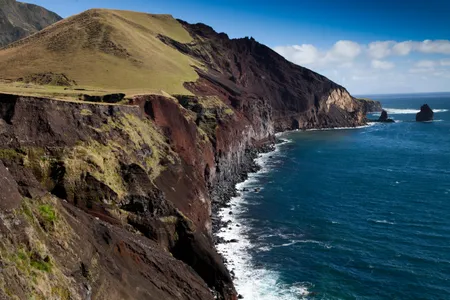 The rugged northwest coast of the island of Tristan. Winds and waves are so rough that many of past inhabitants were shipwrecked sailors who drifted ashore.