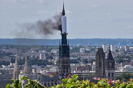 A plastic tarp covering part of the cathedral's spire caught fire on July 11.